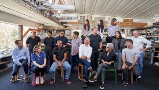 Group photo of the firm employees at their office