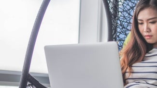 Female AIA member at computer laptop