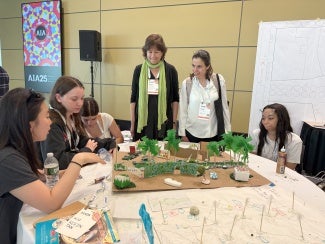 High schoolers present their design to architects.