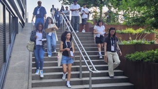 High schoolers visiting the site of their design challenge in Seaport Square.