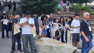 High school students sketch ideas at site visit