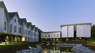 Residential buildings surrounding a small lake/creek