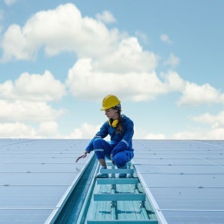 An engineer checks solar panels