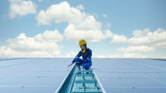 An engineer checks solar panels