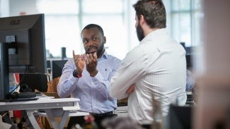 Two architects working together at a computer