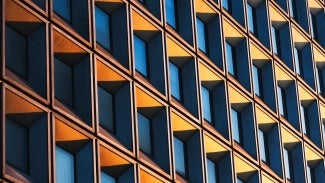 Building with sun glaring into windows