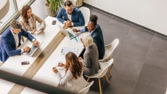 Overhead picture of a table of people working together